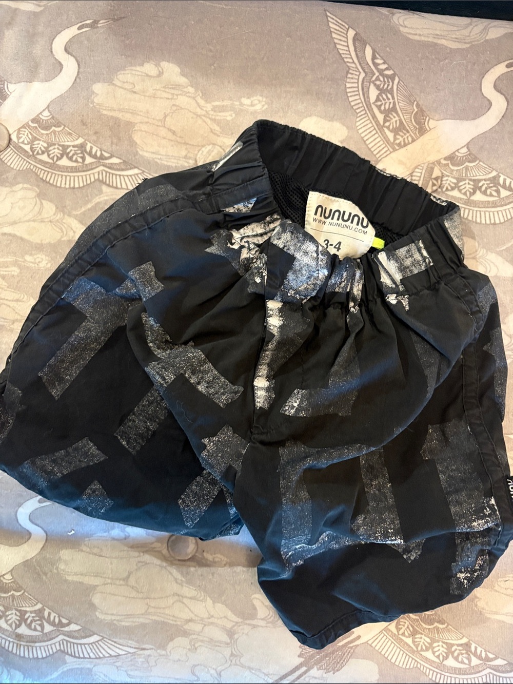 nununu Black Shorts with Silver Cross Print